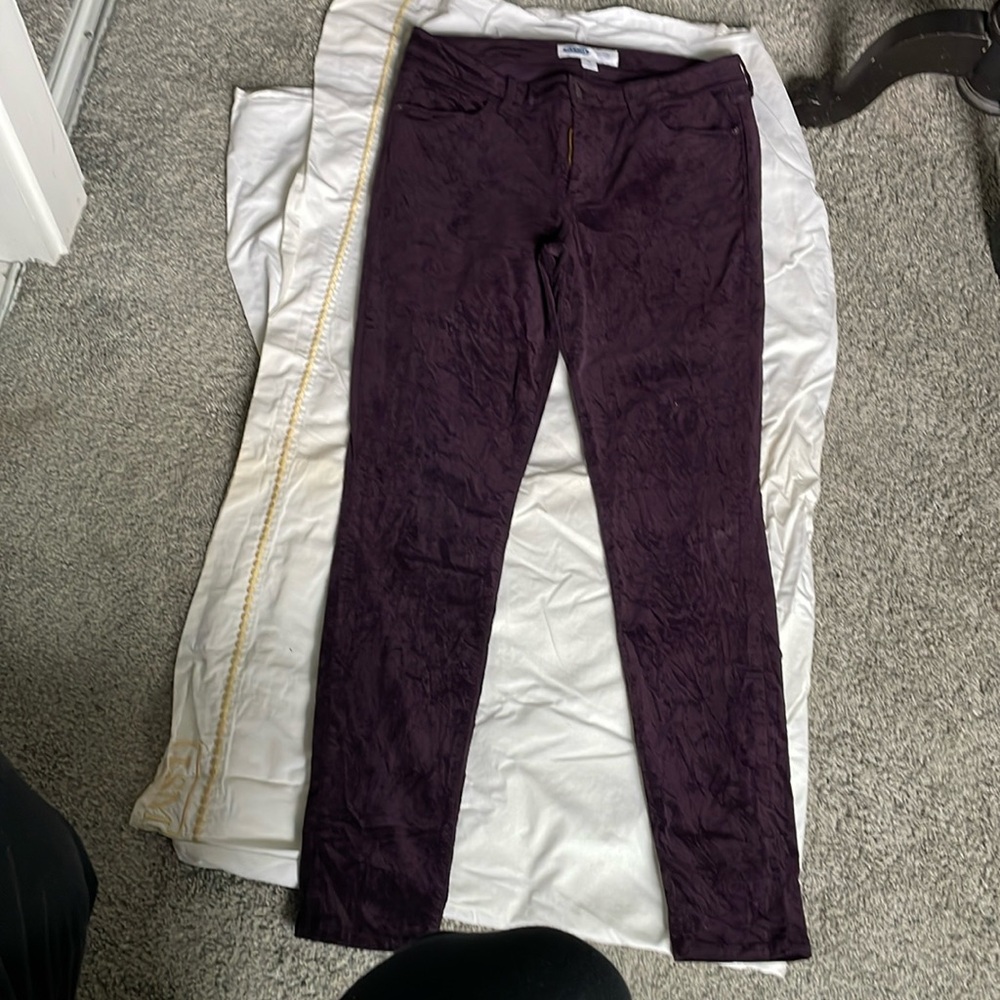 Dark purple velvet straight leg pants.